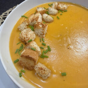 Heart Sweet Potato and Lentil Soup with a kick of chilli and homemade bread croutons and chopped chives