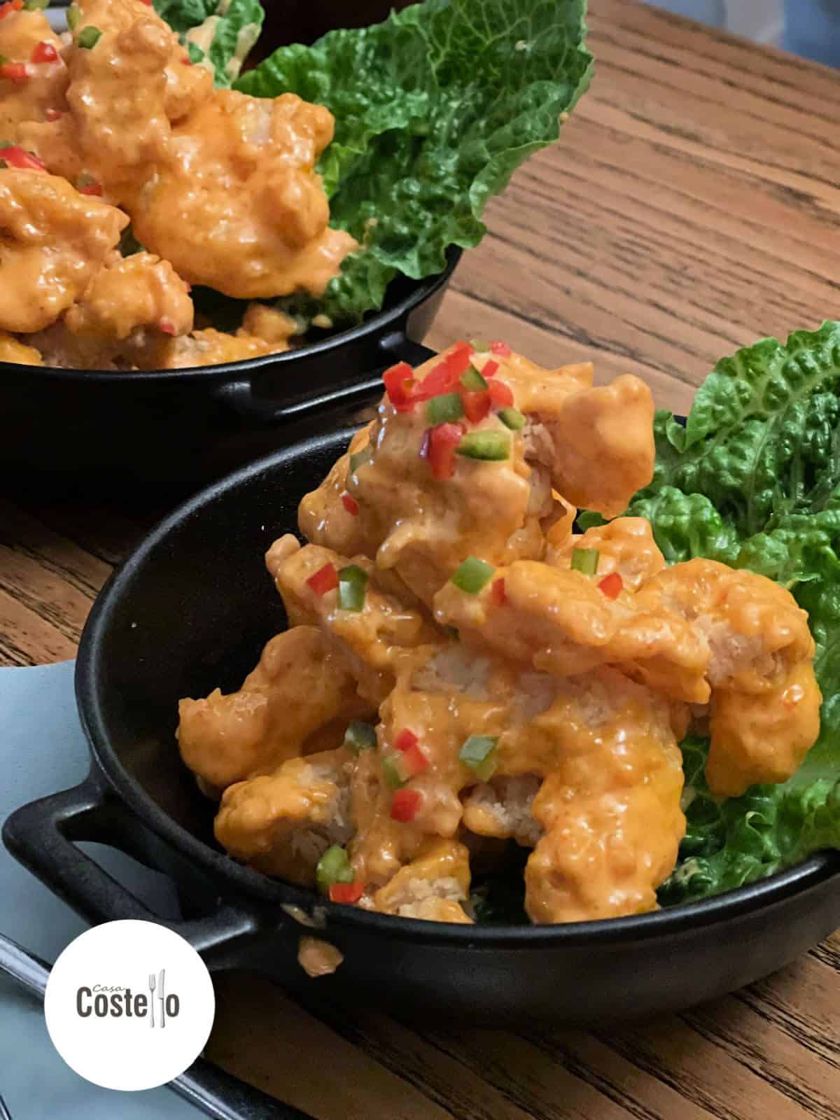 Spicy crispy prawns on a bed of lettuce