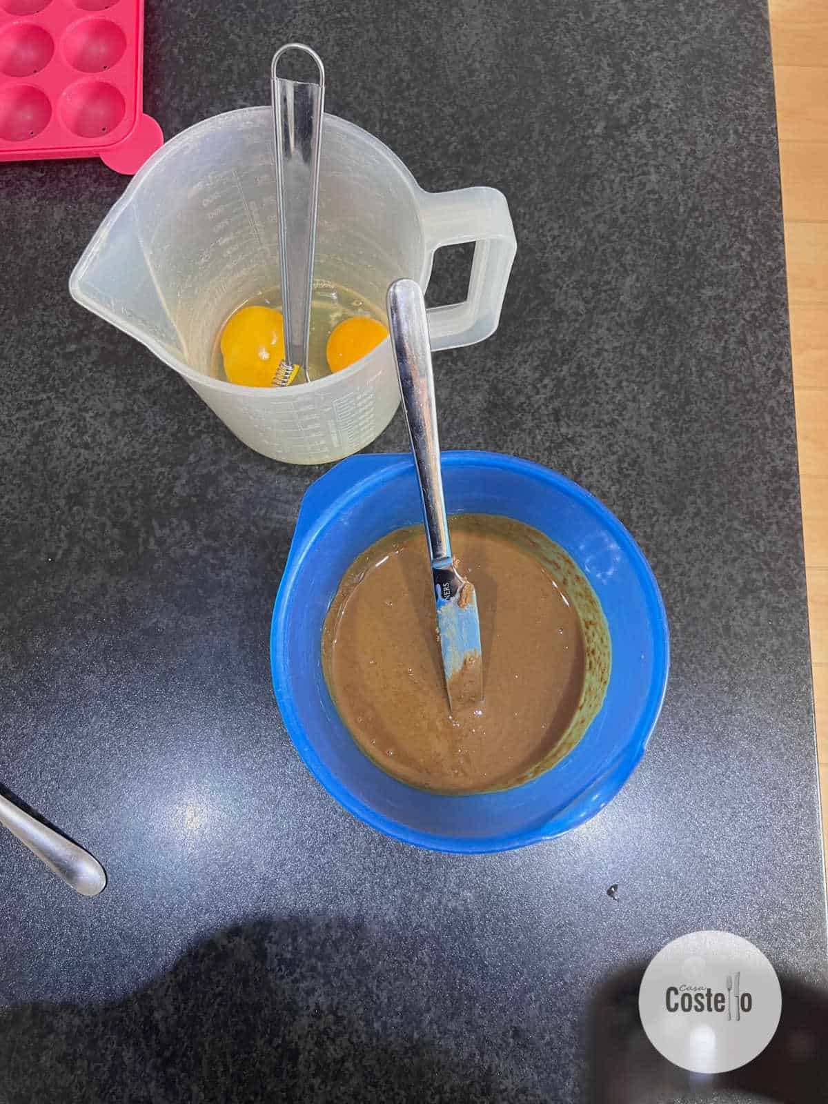 Melted biscoff spread with eggs in a measuring jug
