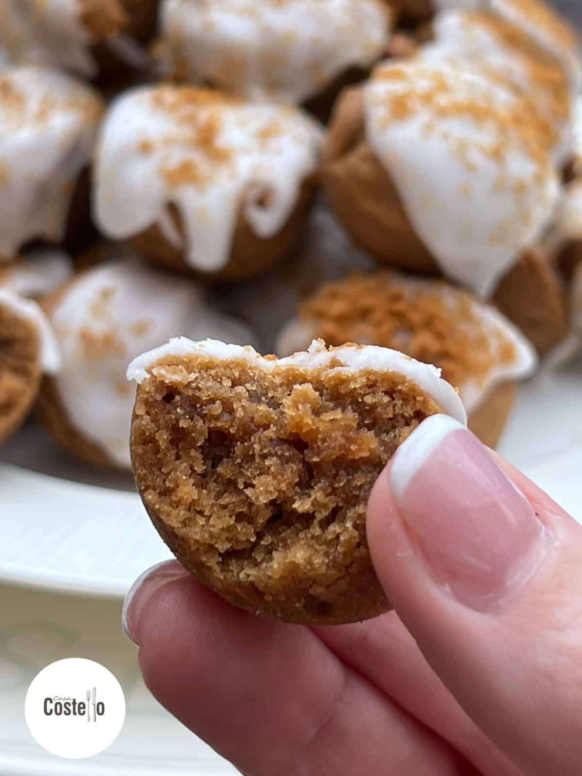 A Brownie bite with a bite taken out of it