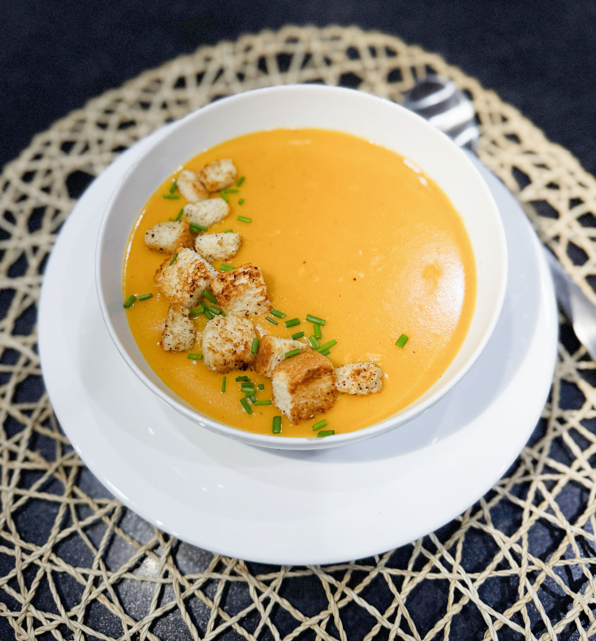 Bowl of bright sweet potato and lentil soup